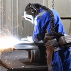 Worker welding in full safety gear