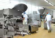 Bottom Injection article Food manufacturing floor featuring food-freezing equipment utilizing bottom injection.