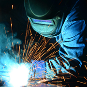 Worker grinding metal