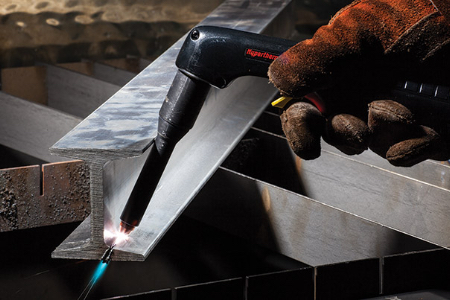 A Powermax user extends the plasma cutter’s reach with HyAccess consumables to more easily perform the desired cut on an I-beam. Photo courtesy of Hypertherm.