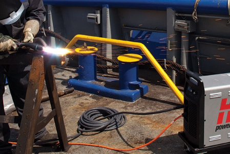 A Hypertherm user gouges a welding workpiece with a Powermax power system