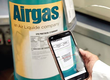 Phone with the Airgas Reorder App on the screen. ALong with an illustration of the Reorder App Trademark graphic