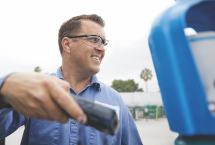 An Airgas driver scans the bar code of a cylinder of ARCAL premium shielding gas for welding with a mobie device