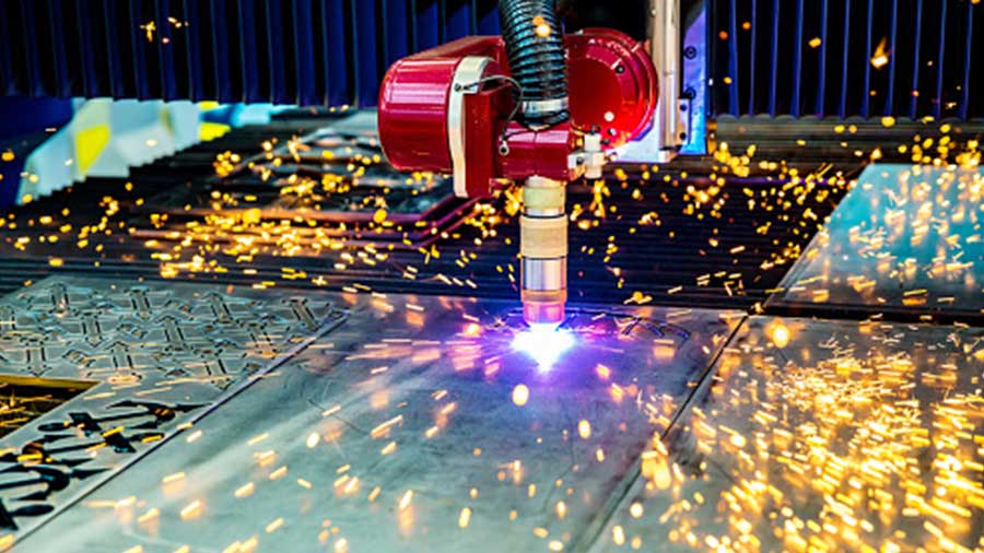 Intricate shapes being cut from sheet metal using a mechanized process