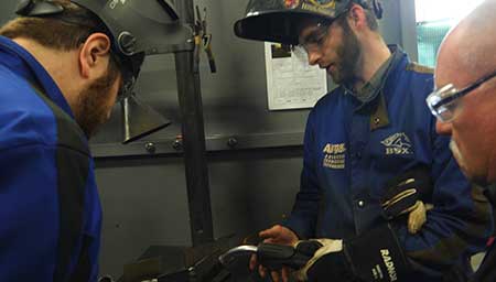 A student learning to TIG weld