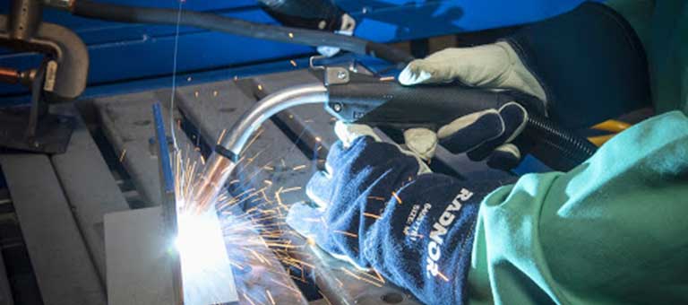 Welder, welding the inside of a giant pipe