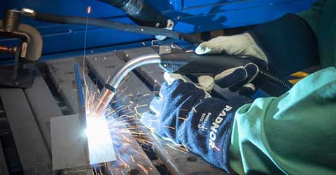 Welder, welding the inside of a giant pipe