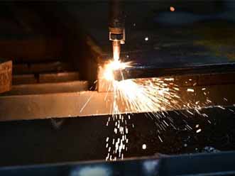 Cutting torch cutting steel beams