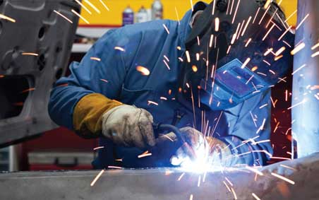 A MIG welder, welding