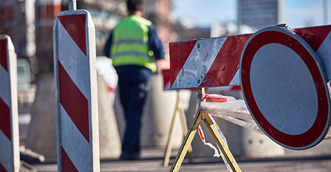 Caution signs closing a road for construction work