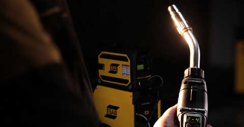 A digital TWECO MIG welding gun with an ESAB weldeing machine in the background