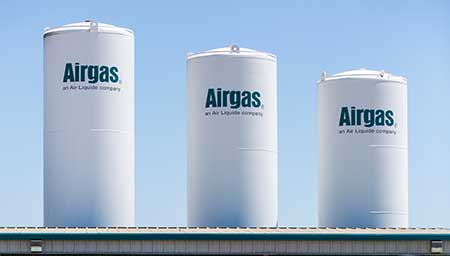 Several on-site bulk tanks, part of an Airgas air separation unit, are an example of the Airgas' multiple supply modes for gases via a robust supply chain and large US footprint.