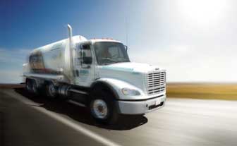 A gas delivery tuck cruzing down an empty highway