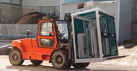 A forklift transporting a Jobsite Skid.