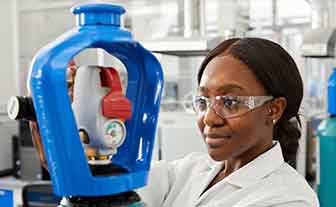 A lab tech checking the gas levels on a SMARTOP
