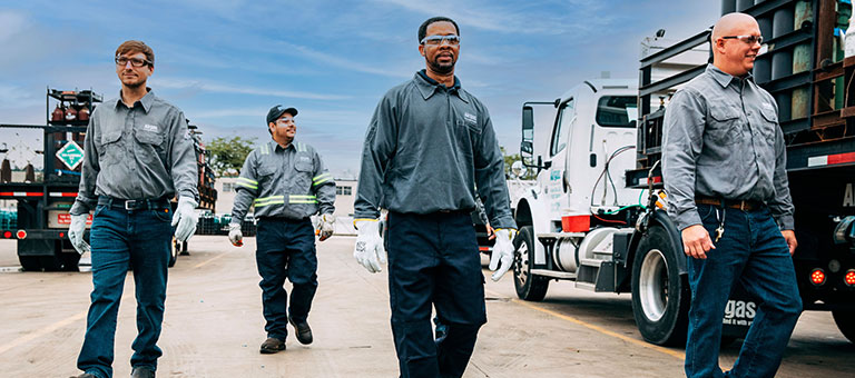 Four Airgas associates walking toward the camera