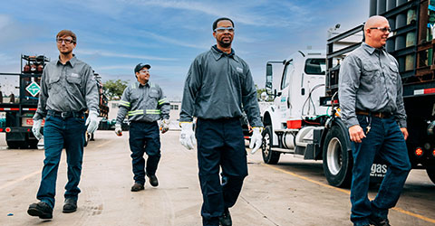 Four Airgas associates walking toward the camera