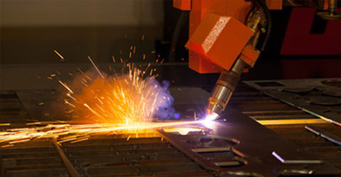A robotic laser cutter, cutting metal