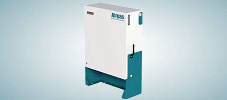 A technician flips the on/off switch on a SMARTOP Cylinder in a laboratory.