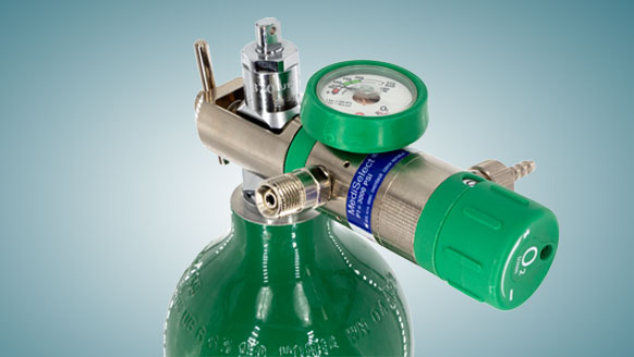 A medical gas cylinder with a regulator attached