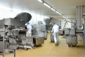 Food manufacturing floor featuring food-freezing equipment utilizing bottom injection.