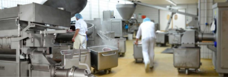 Food manufacturing floor featuring food-freezing equipment utilizing bottom injection.