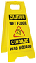 Accuform Signs® 25" X 12" Black/Yellow Plastic Fold-Ups® Floor Sign "CAUTION WET FLOOR CUIDADO PISO MOJADO"