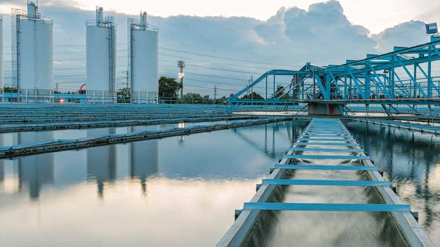 A process water plant with blue piping and bridges.
