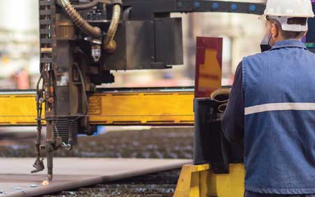 A worker using a mechanized cutting soluton