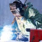 A welder working in the snow